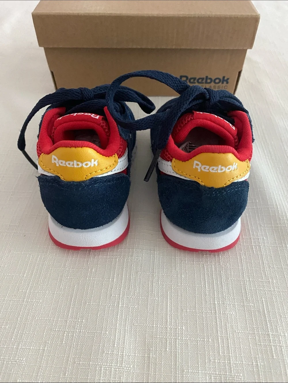 Reebok CL Leather Color Block Sneakers for babies.